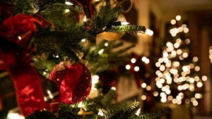 Outdoor christmas light ideas with warm white C9 LEDs framing residential roofline eaves and gables